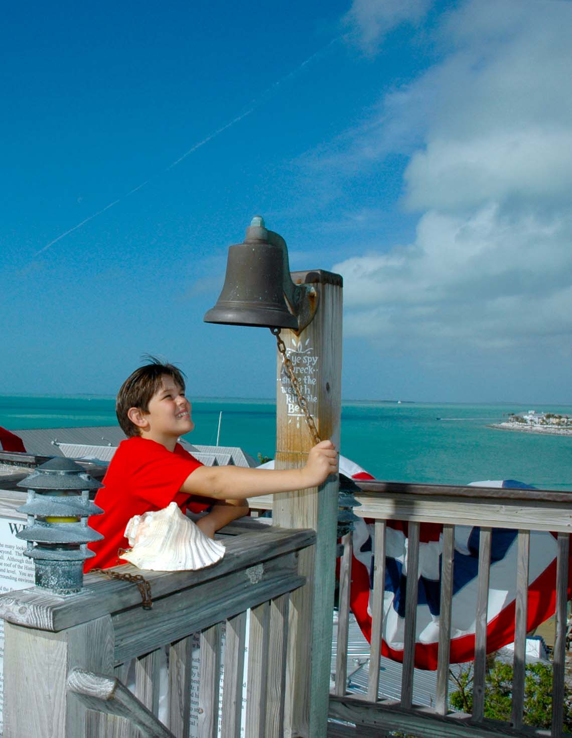 Key West Shipwreck Treasure Museum guest ringing bell at tower